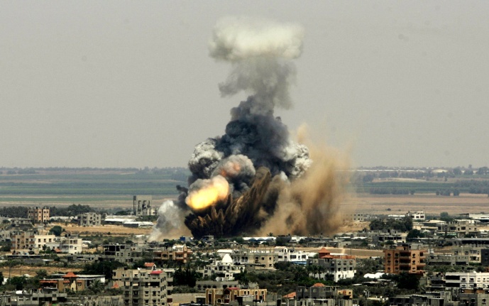 "Smoke and fire rise from an Israeli missle strike in Rafah, Tuesday, July 8, 2014." (AP/Eyad Baba)"
